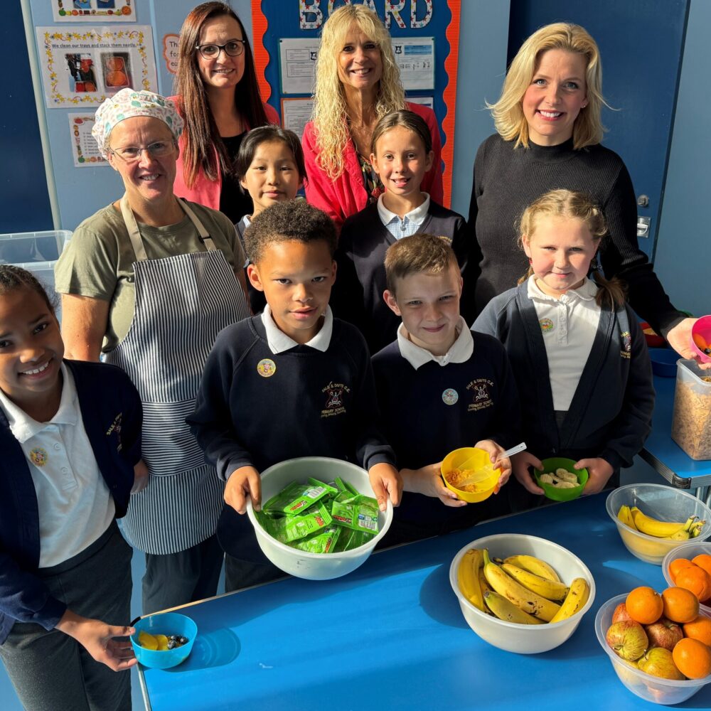 Pupils at the school pick out their favourite breakfasts with, pictured at the back (l to r) teaching assistant Mandy Dudden, school business manager Victoria Lindsay, head teacher Sarah Briggs and South Derbyshire MP Samantha Niblett